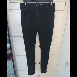 BLACK JEANS. RIPPED.